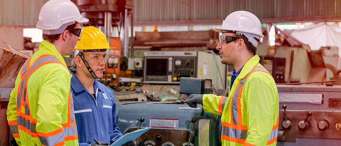 Employees communicating with a supervisor as part of their company's safety culture