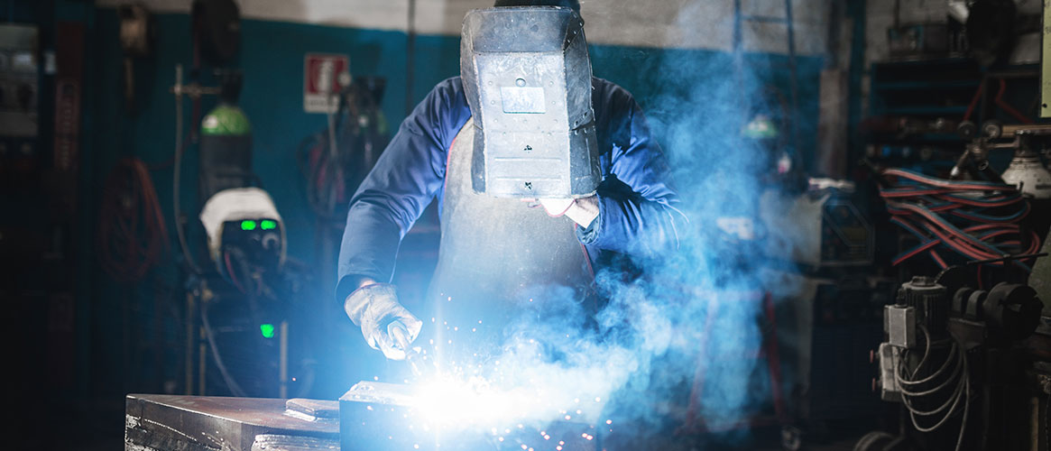 Welder doing hot work- grinding, welding, soldering, and cutting.