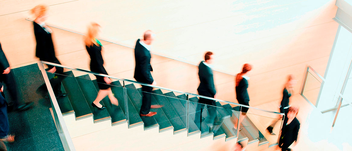 people walking down stairs during emergency evacuation, according to evacuation plan and emergency action plan