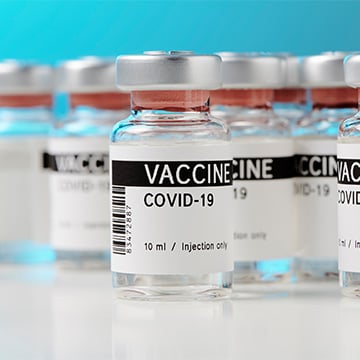 A group of COVID-19 vaccine vials.